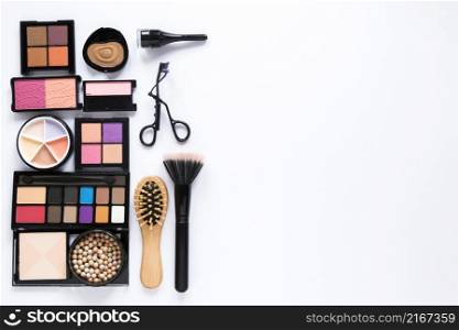 eye shadows with powder brush comb table