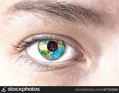 Eye with Earth planet. Close up of female eye with Earth planet. Elements of this image are furnished by NASA
