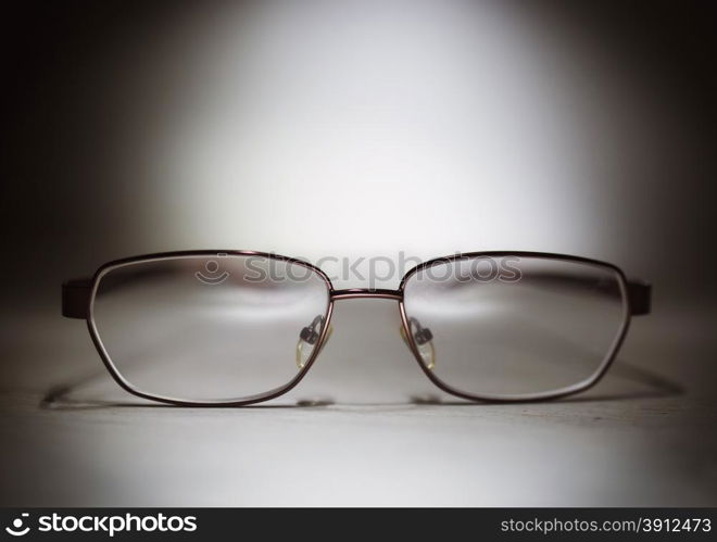 Eyeglasses on a wooden table