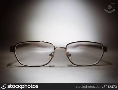 Eyeglasses on a wooden table