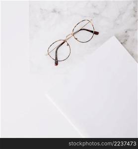 eyeglasses white paper textured white backdrop