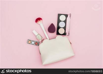 eyeshadow palette nail polish bottle blender makeup brush makeup bag pink background. Resolution and high quality beautiful photo. eyeshadow palette nail polish bottle blender makeup brush makeup bag pink background. High quality beautiful photo concept