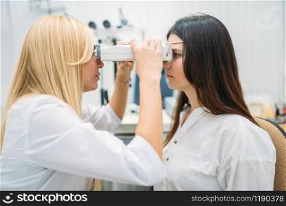 Eyesight test in optician cabinet, diagnostic of vision, professional choice of glasses. Patient and doctor, consultation with specialist, ophthalmology. Eyesight test in optician cabinet, ophthalmology