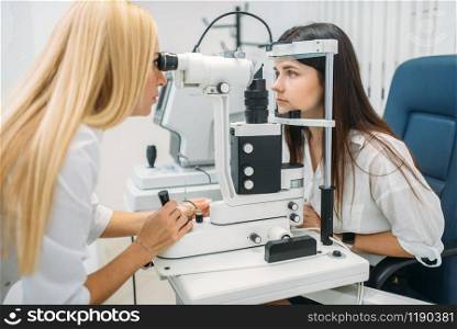 Eyesight test in optician cabinet, diagnostic of vision, professional choice of glasses lens. Patient and doctor, consultation with specialist, ophthalmology. Eyesight test in optician cabinet, choice of lens