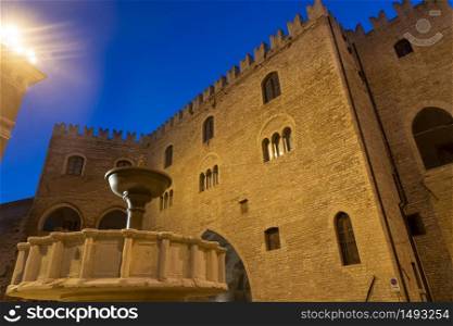Fabriano, Ancona, Marche, Italy: exterior of historic buildings. The main square of the city, Piazza del Comune, by night. Palazzo del Podesta