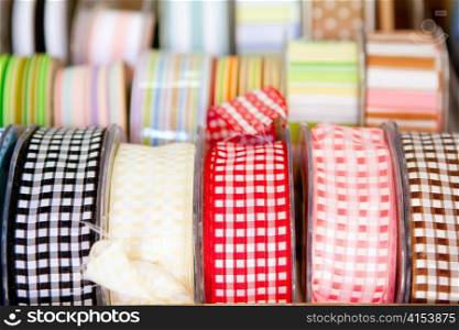 fabric tapes reels in haberdashery of vichy squares