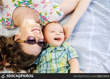 Fabulous mother and her cute laughing son