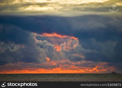 fabulous sunset with many clouds over the ocean