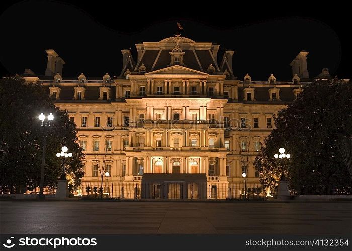 Facade of a building lit up at night, Washington DC, USA