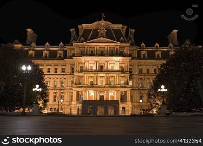 Facade of a building lit up at night, Washington DC, USA