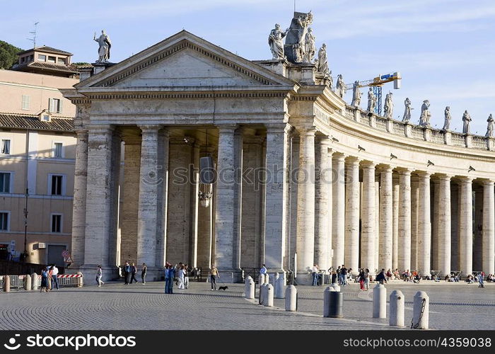 Facade of a church, Bernini&acute;s Colonnade, St. Peter&acute;s Square, Vatican City