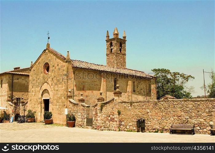 Facade of a church, Romanesque church, Piazza Roma, Monteriggioni, Siena Province, Tuscany, Italy