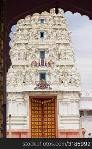 Facade of a Hindu temple seen through an arch, Pushkar, Rajasthan, India