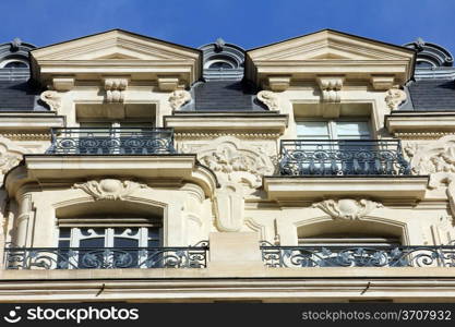 Facade of a traditional apartmemt building in Paris, France
