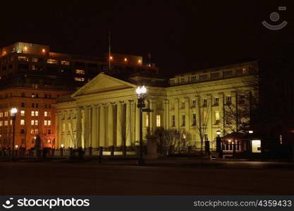 Facade of an art museum lit up at night, National Gallery of Art, Washington DC, USA