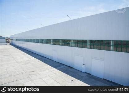 facade of an industrial building and warehouse in length. facade of an industrial building and warehouse