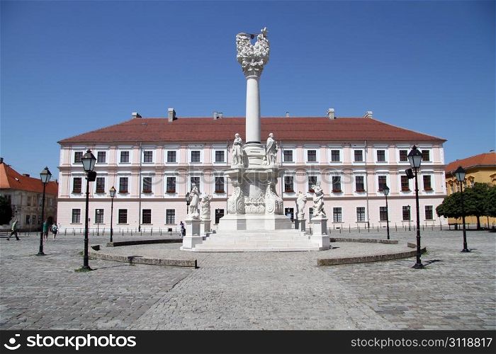 Facade of building and high column on the square in Osijek, Croatia