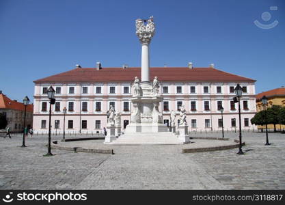 Facade of building and high column on the square in Osijek, Croatia