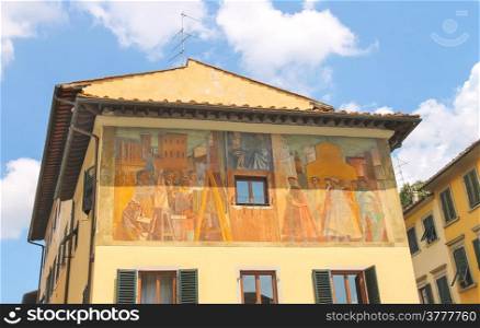 Facade of house is decorated with wall paintings. Florence, Italy