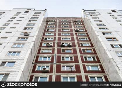 facade of multistory apartment house in winter day