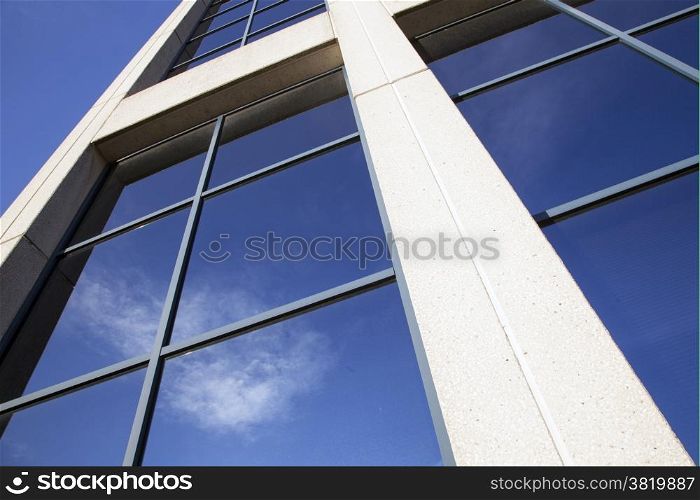 facade of office building with very blue sky and cloud