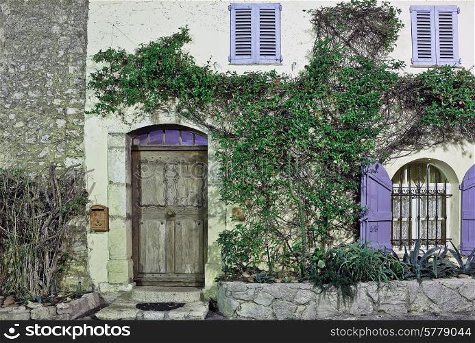 Facade of old European home, France, night view