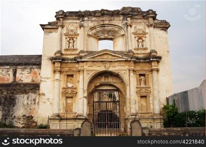 Facade of old yellow church in Antigua Guatemala