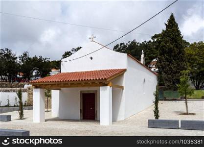 Facade of the Chapel of Malveira, also known as Church of Our Lady of the Assumption, located in the picturesque village of Malveira da Serra, Portugal