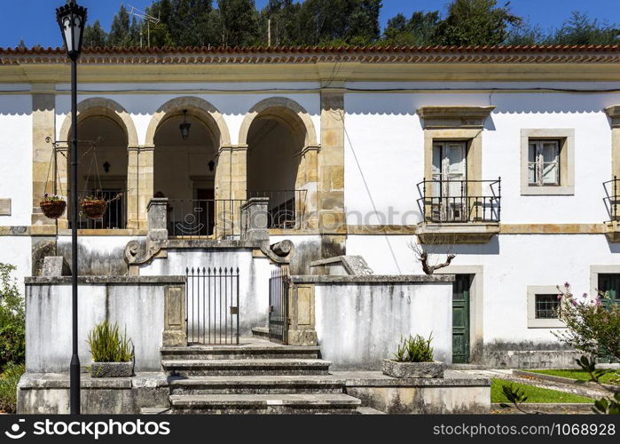 Facade of the former Priests House located in the front garden of the Monastery of Saint Mary of Lorvao, Coimbra, Portugal