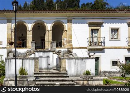 Facade of the former Priests House located in the front garden of the Monastery of Saint Mary of Lorvao, Coimbra, Portugal