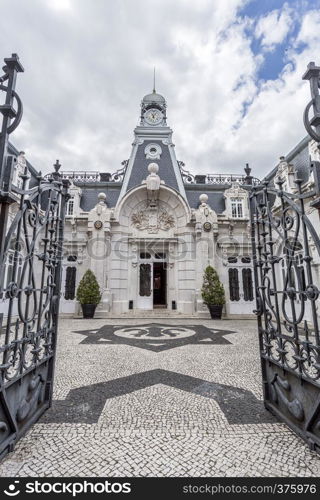 Facade of the horse stables in the same romantic style as the main Vale Flor Palace across the road, in Alcantara, Lisbon, Portugal