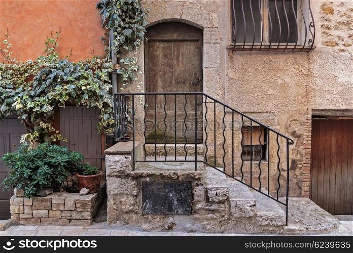 Facade of the old house in medieval village France