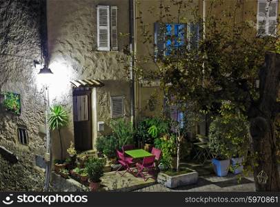 Facade of the old house in medieval village France. Night view