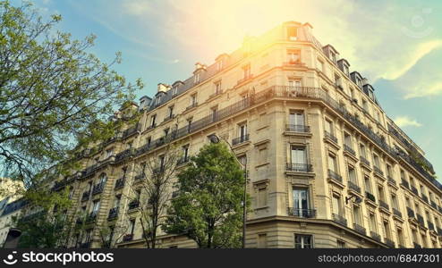 Facade of typical building with attic in Paris, France