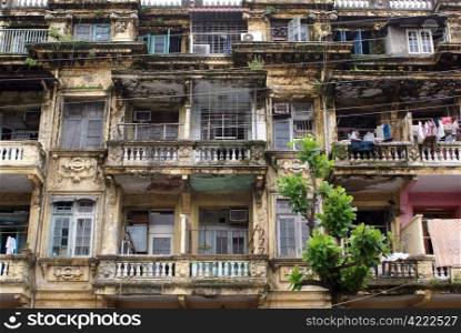 Facade with balconies on the street in Yangon, Myanmar