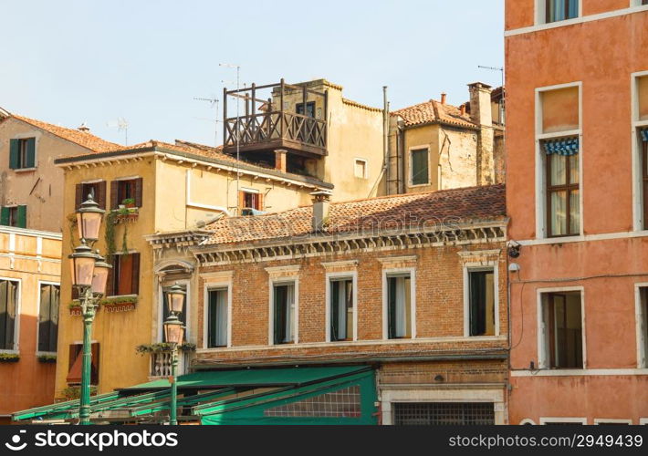 Facades of houses on a street in Venice, Italy