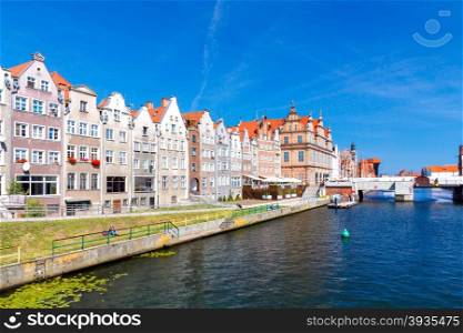 Facades of medieval houses in the center of Gdansk waterfront along the river Motlawa old.. Gdansk. Central embankment.