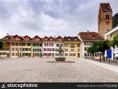 Facades of old colorful houses on Kirchhasser Square. Interlaken. Switzerland.. Interlaken. Old Kirchhasser square.