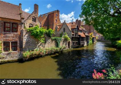 Facades of old medieval buildings on the canals of Bruges.. Brugge. Medieval houses over the canal.