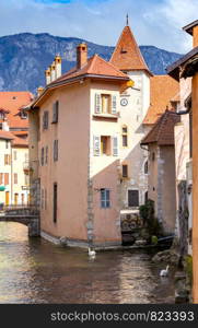 Facades of old medieval houses along the canal. Annecy France.. Annecy Old colorful houses in the historic part of the city.