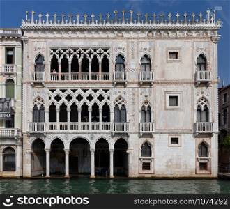 Facades of old medieval houses along the canals. Venice. Italy.. Venice. Old houses over the canal.