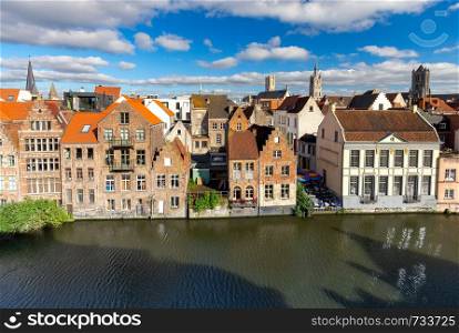 Facades of old medieval houses on the city embankment. Ghent Belgium.. Ghent. Old houses on the city waterfront in the historic part of the city.