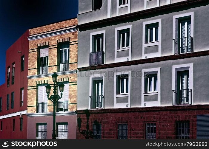 Facades of the Houses in the Spanish City of Cadis at Night, Retro Image Filtered Style