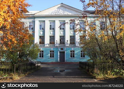 Facadfe of old building with columns in Murmansk, Russia
