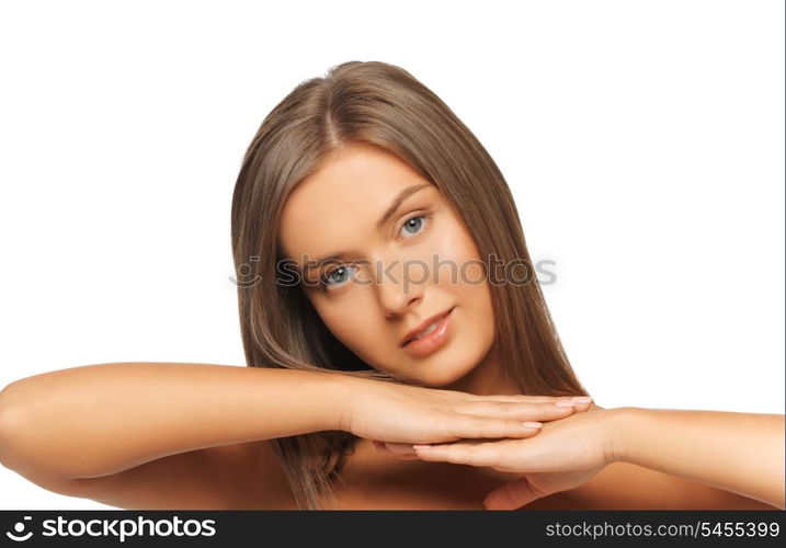 face and hands of beautiful woman with long hair