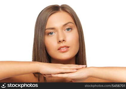 face and hands of beautiful woman with long hair