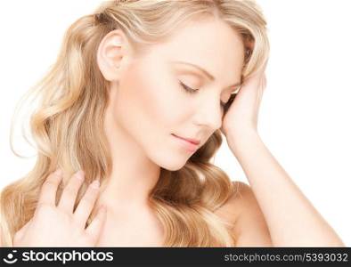 face and hands of worried woman with long hair