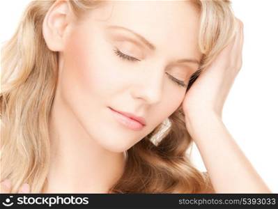 face and hands of worried woman with long hair