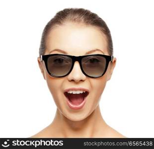 face expressions and people concept - portrait of excited young woman or teenage girl in black 3d glasses. excited young woman in black 3d glasses