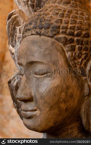 Face front of stone Buddha. Face front of stone Buddha seen in a temple in Angkor Wat